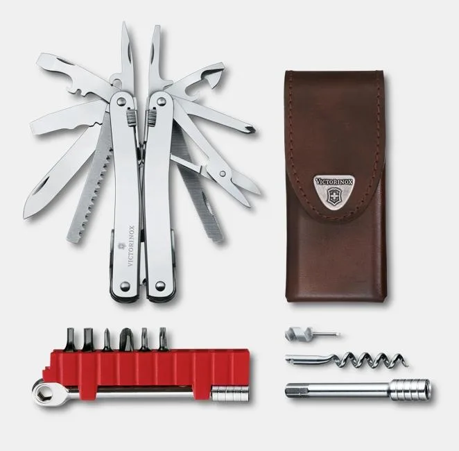 A Victorinox Swiss Army knife with all its tools fanned out is displayed alongside a brown leather sheath, a red ratchet tool, and several metal attachments on a white background.
